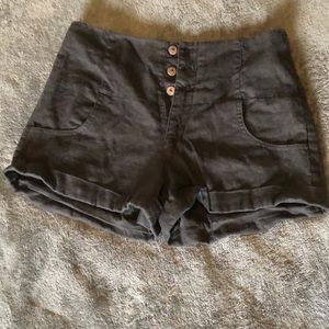 High waisted black shorts.